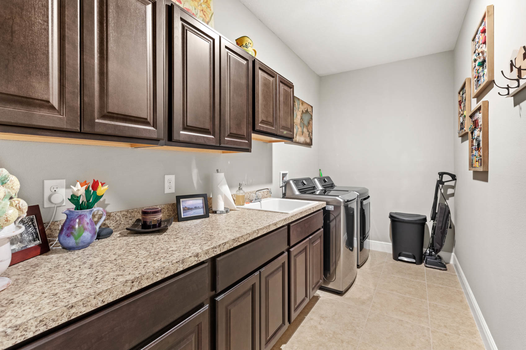 laundry room with brown cabinets